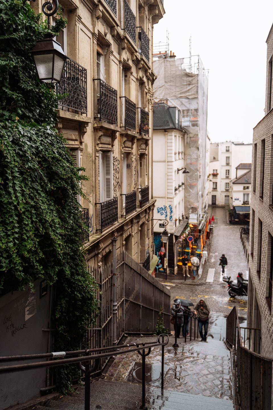 Stone steps descending between buildings in Montmartre